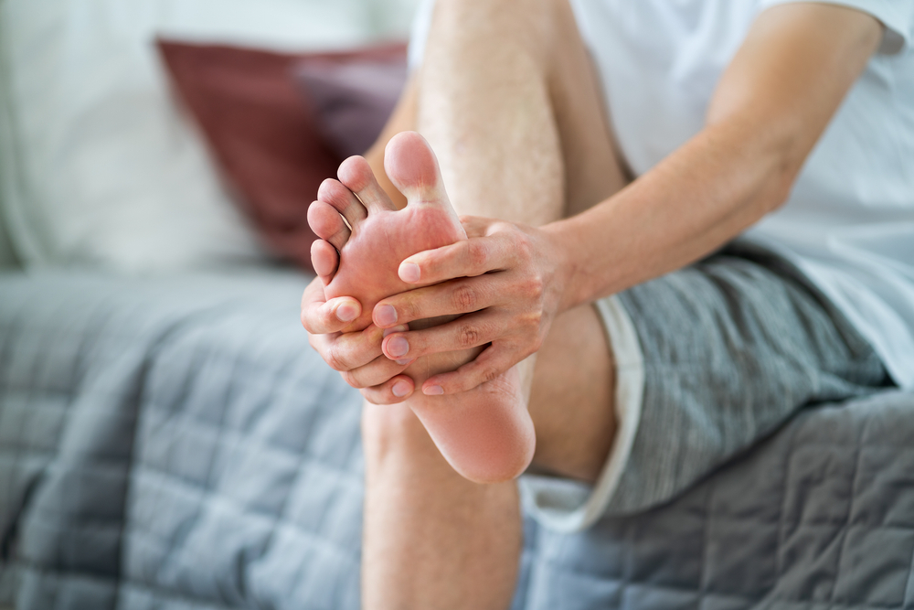 Chiropodist performing a detailed foot health assessment at MedicPlus